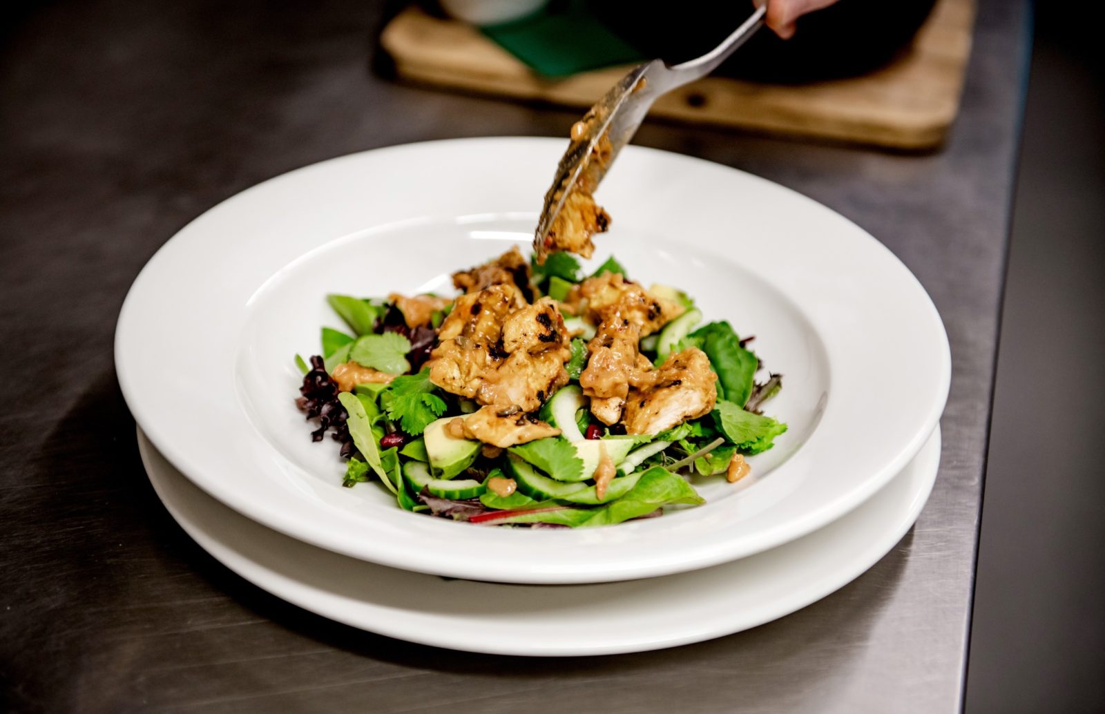 A plate of freshly cooked and prepared food, served on a bed of salad at the Ragged Trousers brasserie and pub in Tunbridge Wells