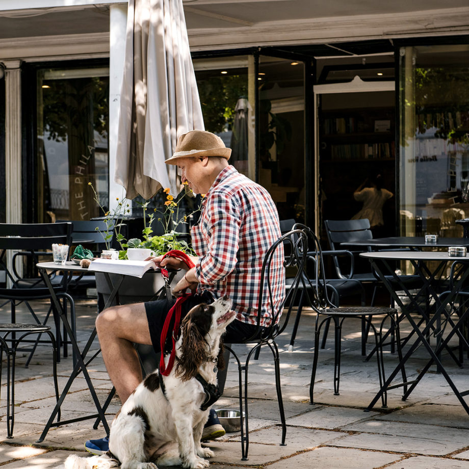 A man sitting outside the Philanthropist cafe in The Pantiles Tunbridge Wells